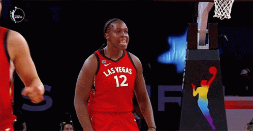 A Female Basketball Player Wearing A Red Jersey With Las Vegas 12 On It GIF