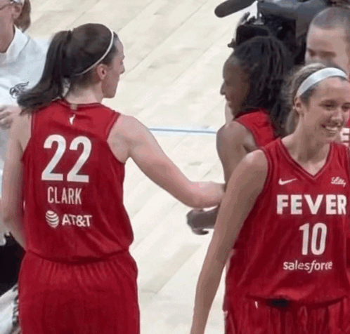 A Female Basketball Player Wearing A Red Jersey With The Number 22 On The Back GIF