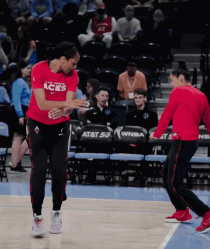 A Female Basketball Player Wearing A Red Shirt That Says Las Vegas Aces GIF