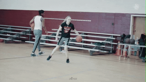 Female Basketball Player Dribbling Ball In Number 9 T-Shirt GIF