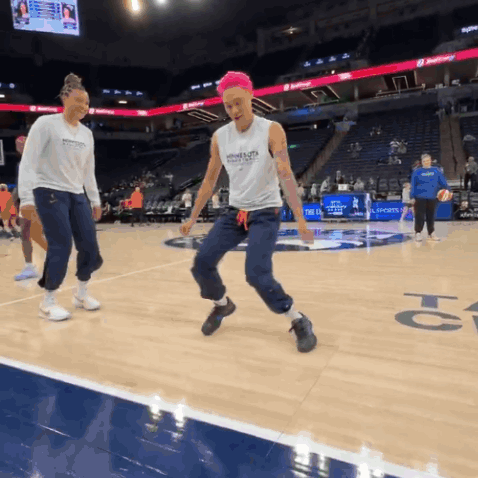 A Female Basketball Player Wearing A Tank Top With The Word Warriors On The Front GIF