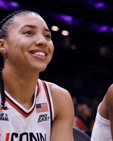 A Female Basketball Player Wears A Jersey That Says Big East GIF