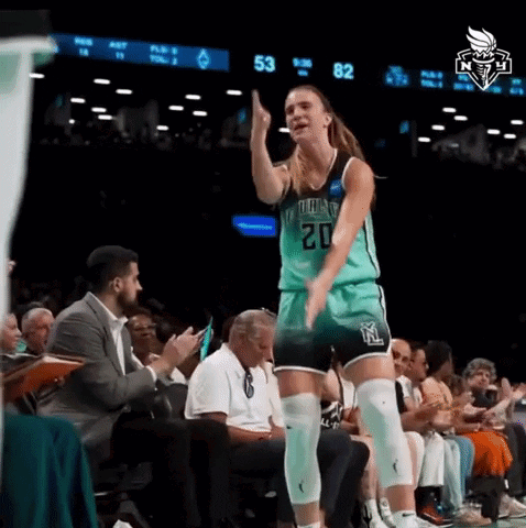 A Female Basketball Player With The Number 20 On Her Jersey Stands On The Court GIF