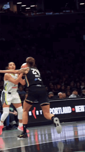 A Female Basketball Player With The Number 21 On Her Back GIF