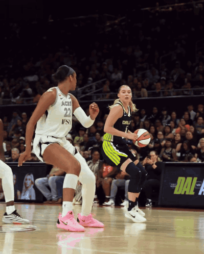 A Female Basketball Player With The Number 22 On Her Jersey Dribbles The Ball GIF