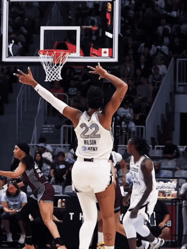 A Female Basketball Player With The Number 22 On The Back Of Her Jersey GIF