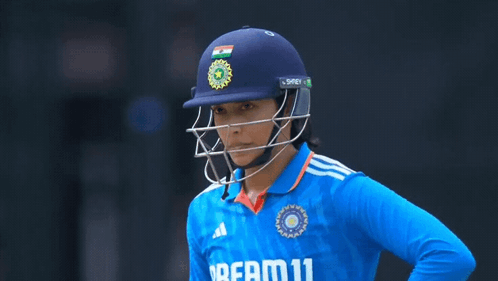 A Female Cricket Player Wearing A Blue Shirt That Says Dream 11 GIF