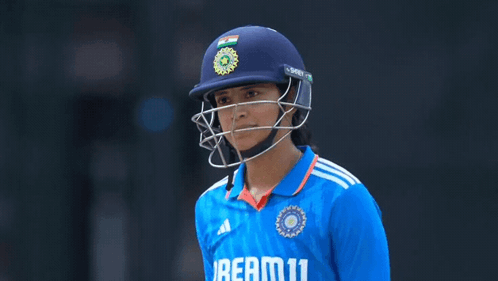 A Female Cricket Player Wearing A Helmet And A Jersey That Says Beam11 GIF