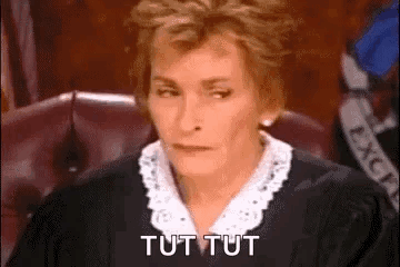 A Female Judge Is Sitting In A Courtroom And Saying Tut Tut . GIF