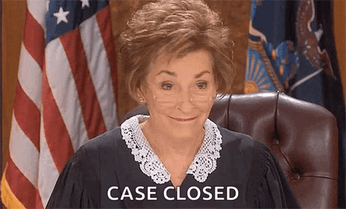 A Female Judge Is Sitting In A Courtroom With The Words `` Case Closed '' Behind Her . GIF