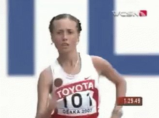A Female Runner Wearing A Toyota Shirt Is Running GIF
