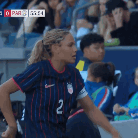 A Female Soccer Player Wearing A Blue Jersey With The Number 2 On It GIF