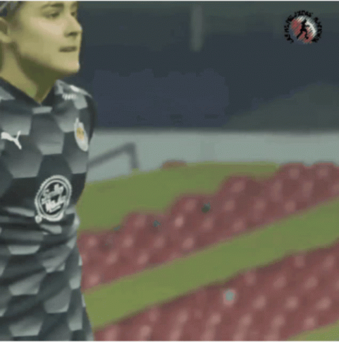 a female soccer player wearing a jersey that says coca cola on it