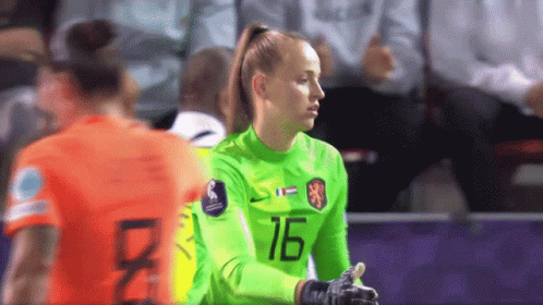 a female soccer player wearing a number 16 jersey