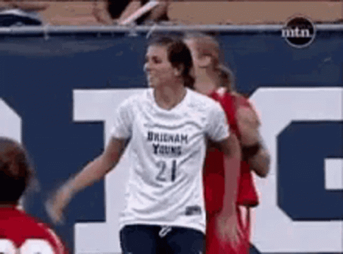 A Female Soccer Player Wearing A Number 21 Jersey GIF