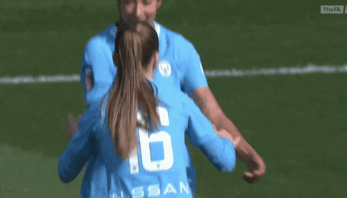A Female Soccer Player Wearing A Number 6 Jersey Is Hugging Another Player GIF