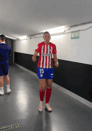 A Female Soccer Player Wearing A Red White And Blue Jersey With The Number 15 On The Shorts GIF