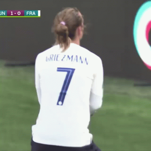 A Female Soccer Player Wearing A White Jersey With The Number 7 On It GIF