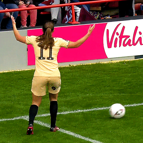 A Female Soccer Player With The Number 11 On The Back Of Her Jersey GIF