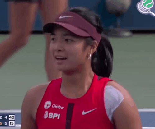 A Female Tennis Player Wearing A Globe Bpi Shirt GIF