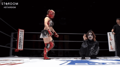 A Female Wrestler In A Ring With A Sign That Says Stardom GIF