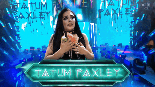 A Female Wrestler Named Tatum Paxley Holds A Cupcake GIF