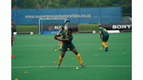 A Field Hockey Game Is Being Played In Front Of A Sony Ad GIF