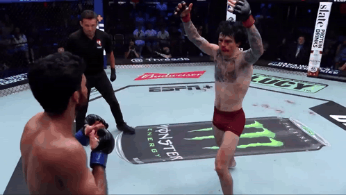 a fighter in a boxing ring with a monster energy can in the background