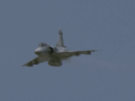 Fighter Jet Flying Through Blue Sky GIF