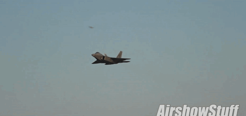 A Fighter Jet Is Flying Through A Cloudy Sky With The Words Airshowstuff Written Below It GIF