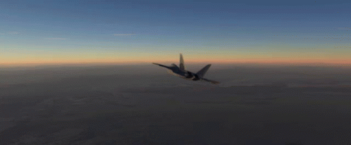 A Fighter Jet Is Flying Through The Air At Sunset GIF