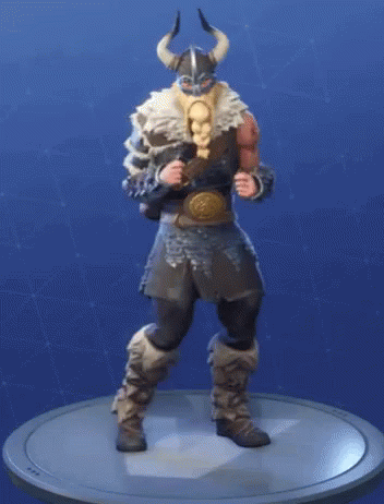 A Figurine Of A Viking With Horns Is Standing On A Round Base . GIF
