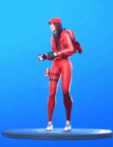 A Figurine Of A Woman In A Red Outfit Is Standing On A Blue Surface . GIF