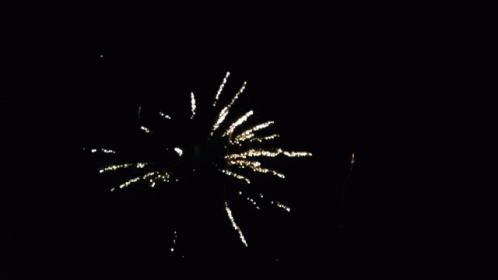 A Fireworks Display In The Night Sky With The Sun Visible In The Background GIF