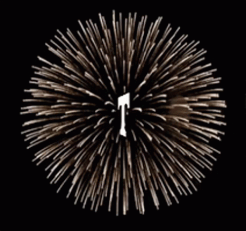 A Fireworks Display With A Letter T In The Center GIF