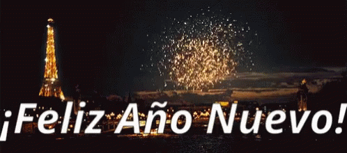 A Fireworks Display With The Words Feliz Ano Nuevo In White Letters GIF