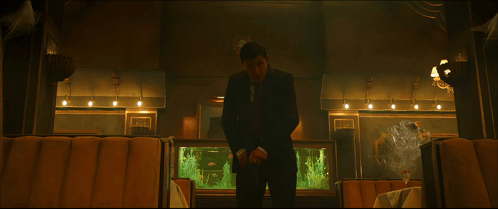 A Fish Tank In A Restaurant With A Sign On The Wall That Says ' Fish ' On It GIF