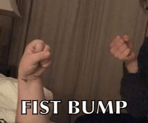 A Fist Bump Is Being Displayed On A Person 'S Arm GIF