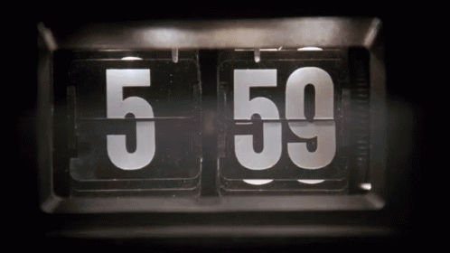 A Flip Clock With The Number 5 And 59 On It GIF