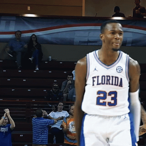A Florida Basketball Player Wearing Number 23 Stands On The Court GIF