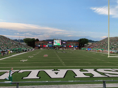 A Football Field With The Word Jets On The Grass GIF