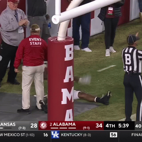 A Football Game Between Alabama And Kentucky Is Being Shown On A Television Screen GIF