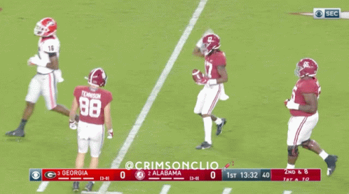 a football game between georgia and alabama is being played