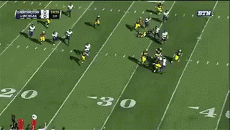 a football game between michigan and washington is being played