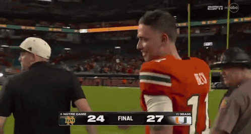 A Football Game Between Notre Dame And Miami Is On Espn GIF