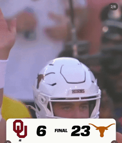 a football game between oklahoma and texas is going on