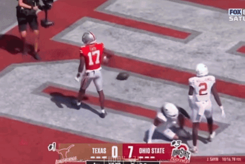 A Football Game Between Texas And Ohio State Is On Fox GIF