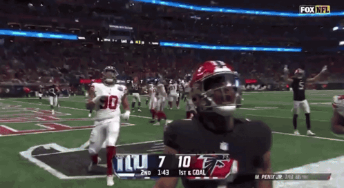A Football Game Between The Giants And The Falcons GIF
