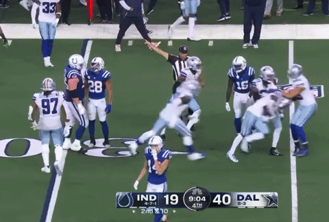 a football game between the indiana colts and the dallas cowboys is underway