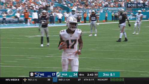 A Football Game Between The Miami Dolphins And The New England Patriots On Cbs GIF